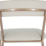 Back view showing white faux leather backrest with brass-finished metal supports