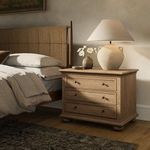 Geoffrey Veneer Nightstand styled in bedroom setting with lamp, vase, and bedding