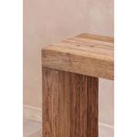 Close-up showing corner joint and detailed wood grain texture on tabletop and leg.