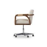Rosie desk chair side view revealing thickness of cushions and curved armrest wrapped in cotton rope