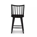 Rear view of Lewis Windsor Bar + Counter Stool highlighting vertical spindles and wood grain on seat