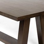 Close-up of Silverton Dining Table corner with beveled edges and brown wood grain texture