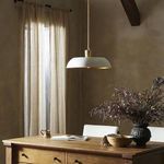 Walton Pendant viewed at slight angle showing smooth curve of white shade and gold fixture