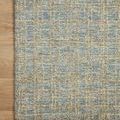 Close-up of Polly Blue / Sand Rug corner on light wood floor highlighting edges