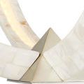 Close detail of one silver pyramid accent and two converging chandelier ribs with mother-of-pearl finish