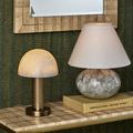 Close-up focus of alabaster dome shade displaying subtle white veining pattern