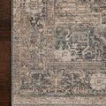 Edge-on perspective showing the rug’s low pile thickness and subtle fringe detail