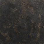 Detailed view of distressed bronze finish with mottled dark and light bronze tones