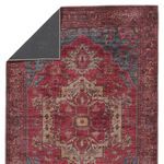 Top view with a corner flipped over to reveal dark gray backside fabric of the rug