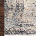 Close-up of rug corner on dark hardwood floor highlighting pattern and edge detail