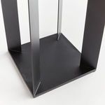 Close-up of the lantern’s flat square base and four vertical supports