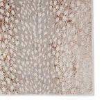 Close-up on rug surface highlighting spotted pattern detail and subtle color transitions