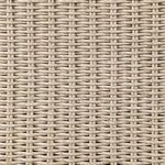 Close-up of textured vintage white rattan weave pattern on banquette
