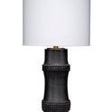 Black resin table lamp with a bamboo cane-inspired body and beaded embellishments, topped with a white linen drum shade