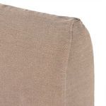 Back corner detail showing fitted flax linen slipcover stitching on backrest