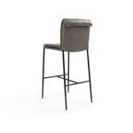 Rear angle view revealing rolled leather backrest and iron frame structure of Mayer Stool