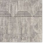 Close-up detail of geometric tile pattern emphasizing linear texture and contrast