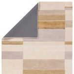 Back corner folded to reveal solid gray underside backing of Berkay Handmade Geometric Gray Rug
