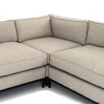 Close-up of sofa corner cushions showing tight seams and integrated design