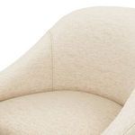 Close-up of textured boucle fabric upholstery on Levi Boucle Dining Chair in cream