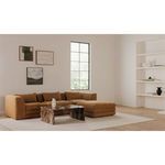 Lowtide Lounge Modular Sectional styled in bright room with marble coffee table, art on wall, and large window