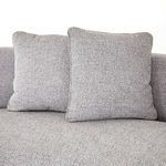 Two large square back cushions in grey linen-blend fabric on curved sectional backrest