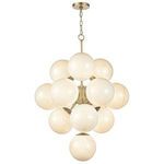 Warm swirl glass chandelier hanging in softly lit bright room
