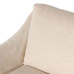 Detailed view of angled slipcover and seat cushion corner with subtle fabric texture