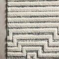Close-up showing the textured raised polypropylene pile and pattern of Hagen White / Sky Rug