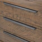 Detailed close-up showing rustic wood texture and varied grain patterns on dresser front