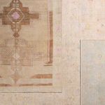 Two rugs overlapping showing difference in color and pattern with Doire rug in pale pastel hues