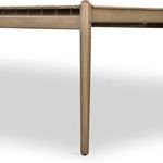 Detail of slender, tapered wooden leg attached beneath table frame