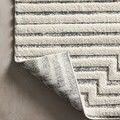 Corner of Hagen White / Sky Rug flipped to show flat weave backing texture and pattern reverse