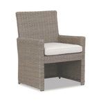 Coronado Dining Chair in driftwood resin wicker with plush off-white cushion and transitional armrest design