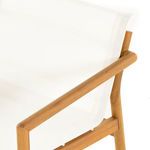 Close-up showing wooden joinery and sling attachment between the sofa legs