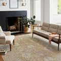 Round version of Rosemarie rug in Gold/Sand with same distressed floral pattern
