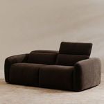 Angled view of charcoal brown recliner sofa with right seat footrest extended and backrest lowered