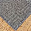Close-up of plush high-low viscose pile and geometric pattern on Gramercy Dark Silver Rug on wooden floor