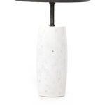 Close-up front view showing solid turned marble base supporting tray top