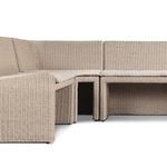 Close-up corner joins of rattan frame with fabric cushions on outdoor banquette