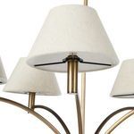 Close-up of a single tapered fabric shade with bronze holder and supporting arms