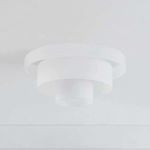 Layered flush mount ceiling light with three concentric clear cloud glass shades and central bulb