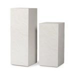 Two pedestals placed side by side showing height difference and textured white surface