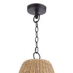 Close-up of black ceiling mount and chain suspension of woven rattan pendant light