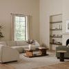 Vernon Accent Chair in green fabric styled in spacious beige living room with curved sectional sofa and large window