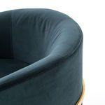 Rounded velvet armrest curve of Corbin Chair showing stitching detail