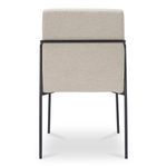 Close-up angled image focusing again on ivory fabric texture and slim iron legs