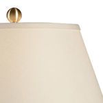 Close-up of antique brass ball finial and eggshell fabric lampshade of Fulton Vase Lamp