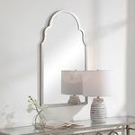 Side angle view of Olivia Mirror showing frame thickness and partial reflection of lamp