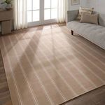 Indoor living room scene highlighting rug underfoot alongside tufted beige sofa